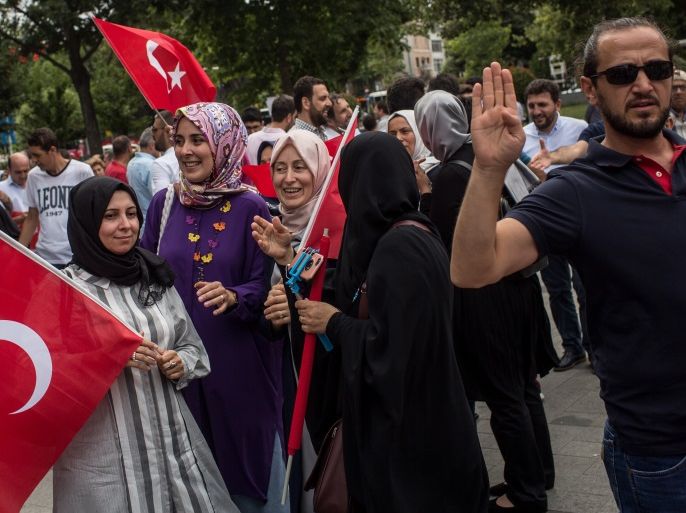 ISTANBUL, TURKEY - JULY 14: People are seen holding Turkish flags during a rally to honour the victims of the July 15, 2016 coup attempt aa day head of the first anniversary of the failed coup attempt on July 14, 2017 in Istanbul, Turkey. July 15, 2017 will mark the first anniversary of the failed coup attempt which saw 249 people die when military personnel attempted to over throw the government and President Recep Tayyip Erdogan. Extensive commemorations have been planned for the July 15 anniversary and the day has been declared an annual holiday. (Photo by Chris McGrath/Getty Images)