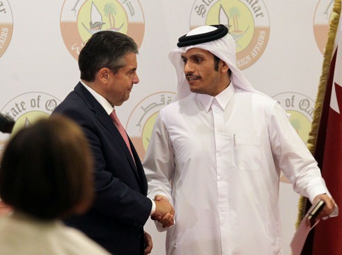 Qatar's Foreign Minister Sheikh Mohammed bin Abdulrahman al-Thani (R) shakes hands with German Foreign Minister Sigmar Gabriel following a joint news conference in Doha, July 4, 2017. REUTERS/Naseem Zeitoon
