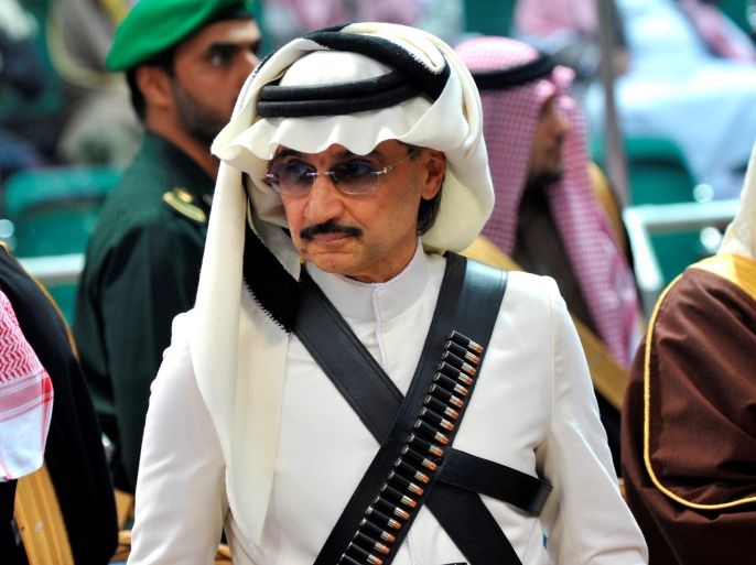 Prince Alwaleed bin Talal attends the traditional Saudi dance known as 'Arda', which was performed during Janadriya culture festival at Der'iya in Riyadh February 18, 2014. REUTERS/Fayez Nureldine/Pool/File Photo