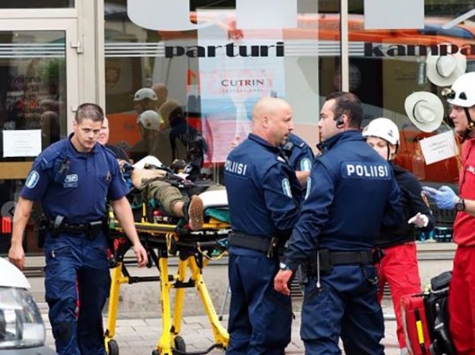 A photo taken from the Instagram account of Kirsi Kanerva on August 18, 2017 shows police officers standing next to a person lying on a stretcher in the Finnish city of Turku where several people were stabbed. Several people were stabbed in the southwestern Finnish city of Turku, police said after shooting and arresting a suspect. Public television station Yle reported that central Turku was on lockdown, with witnesses saying they had seen bodies lying on the ground in