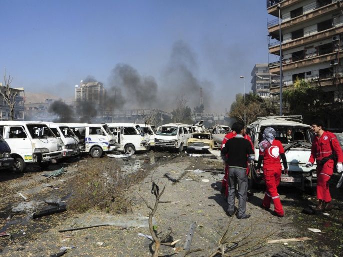 Damaged vehicles and the Russian embassy building (rear C) are seen after an explosion in central Damascus February 21, 2013, in this handout photograph released by Syria's national news agency SANA. A car bomb killed 53 people and wounded 200 in central Damascus on Thursday when it blew up on a busy highway close to ruling Baath Party offices and the Russian Embassy, Syrian television said. REUTERS/Sana (SYRIA - Tags: CONFLICT POLITICS) ATTENTION EDITORS - THIS PICTURE WAS PROVIDED BY A THIRD PARTY. REUTERS IS UNABLE TO INDEPENDENTLY VERIFY THE AUTHENTICITY, CONTENT, LOCATION OR DATE OF THIS IMAGE. FOR EDITORIAL USE ONLY. NOT FOR SALE FOR MARKETING OR ADVERTISING CAMPAIGNS. THIS PICTURE IS DISTRIBUTED EXACTLY AS RECEIVED BY REUTERS, AS A SERVICE TO CLIENTS