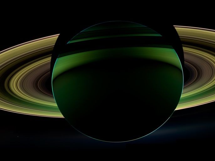 The Cassini spacecraft took this mosaic of the planet Saturn and its rings backlit against the Sun on October 17, 2012 using infrared, red and violet spectral filters that were combined to create an enhanced-color view, in this handout image courtesy of NASA. The images were obtained with the Cassini spacecraft wide-angle camera at a distance of approximately 500,000 miles (800,000 kilometers) from Saturn. Also captured are two of Saturn's moons: Enceladus and Tethys. Both appear on the left side of the planet, below the rings. Enceladus is closer to the rings; Tethys is below and to the left. REUTERS/NASA/JPL-Caltech/Space Science Institute/Handout (OUTER SPACE - Tags: ENVIRONMENT SCIENCE TECHNOLOGY TPX IMAGES OF THE DAY) FOR EDITORIAL USE ONLY. NOT FOR SALE FOR MARKETING OR ADVERTISING CAMPAIGNS. THIS IMAGE HAS BEEN SUPPLIED BY A THIRD PARTY. IT IS DISTRIBUTED, EXACTLY AS RECEIVED BY REUTERS, AS A SERVICE TO CLIENTS
