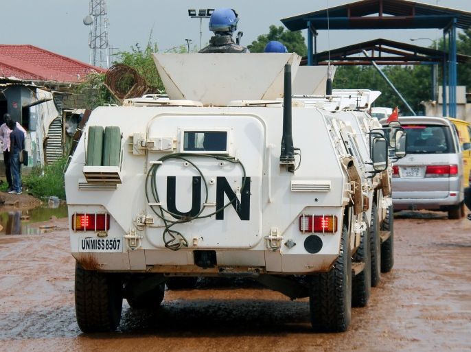 Chinese Peacekeepers in the United Nations Mission to South Sudan (UNMISS) ride in their armoured personnel carriers (APC) as they wait in the queue to enter their base in Juba, South Sudan August 1, 2017. Picture taken August 1, 2017. REUTERS/Samir Bol