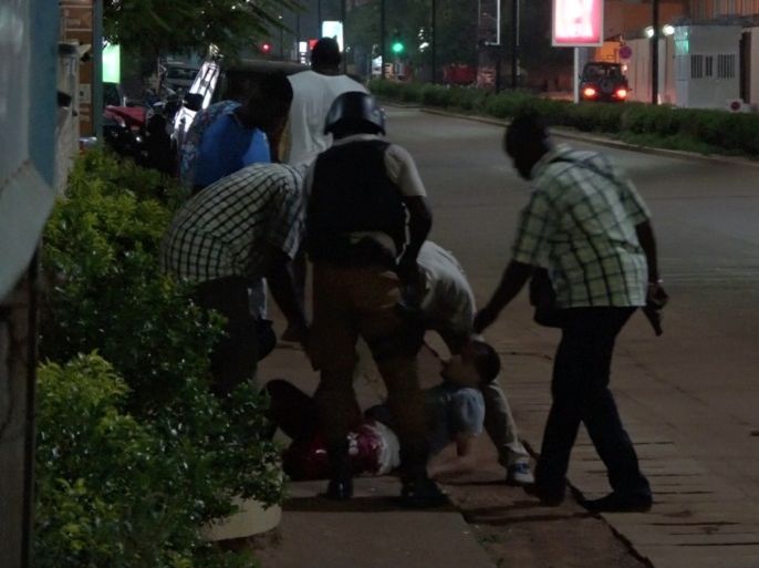 A wounded unidentified person is evacuated following an attack by gunmen on a restaurant in Ouagadougou, Burkina Faso, in this still frame taken from video August 13, 2017. REUTERS/Reuters TV TPX IMAGES OF THE DAY