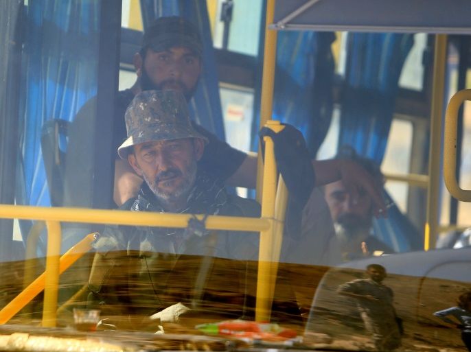 Saraya Ahl al-Sham fighters sit in a bus in Jroud Arsal, near Syria-Lebanon border, August 14, 2017. REUTERS/Ali Hashisho