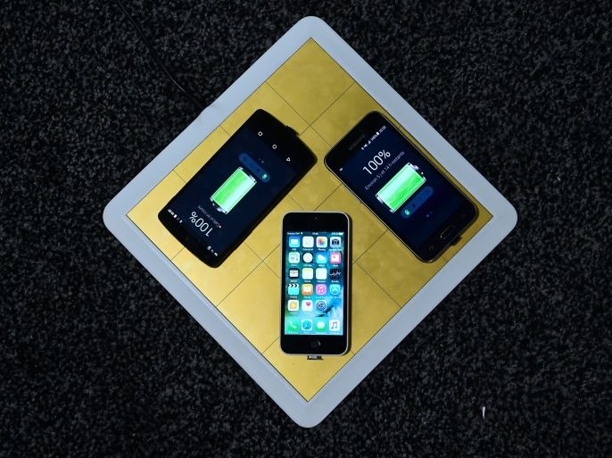 The Energysquare charging pad, made of conductive squares, compatible with smartphones and tablets with a simple sticker, is displayed during the 2017 Consumer Electronic Show (CES) in Las Vegas, Nevada, January 6, 2017. / AFP / Frederic J. BROWN (Photo credit should read FREDERIC J. BROWN/AFP/Getty Images)