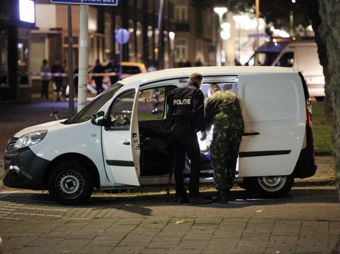 TOPSHOT - Police investigates a van with Spanish number plate packed with gas canisters in the vicinity of the concert venue Maassilo, after a concert was cancelled because of a terror threat, in Rotterdam, on August 23, 2017. A rock concert in Rotterdam was cancelled on August 23 due to a terror threat involving a Spanish van found with gas bottles inside, the local mayor said. Earlier the Maassilo venue announced that 'due to a terrorist threat, the Allah-Las concert