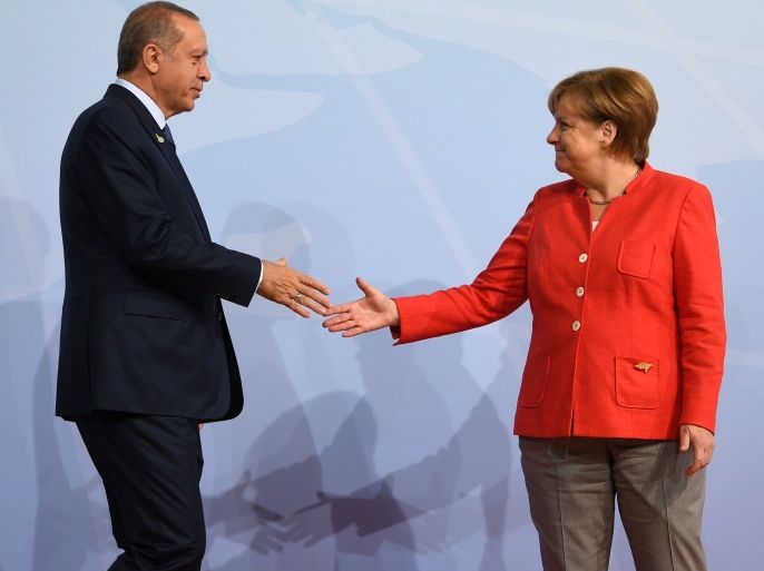 German Chancellor Angela Merkel greets Turkey's President Recep Tayyip Erdogan at the beginning of the G20 summit in Hamburg, Germany, July 7, 2017. REUTERS/Bernd Von Jutrczenka/POOL