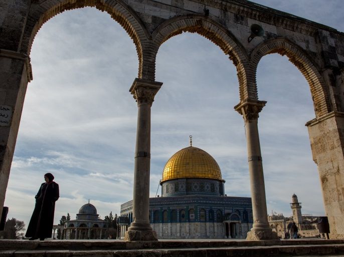 JERUSALEM, ISRAEL - JANUARY 17: A woman stands in front of the Dome of the Rock at the Al-Aqsa mosque compound in the Old City on January 17, 2017 in Jerusalem, Israel. 70 countries attended the recent Paris Peace Summit and called on Israel and Palestinians to resume negotiations that would lead to a two-state solution, however the recent proposal by U.S President-elect Donald Trump to move the US embassy from Tel Aviv to Jerusalem and last month's U.N. Security Coun