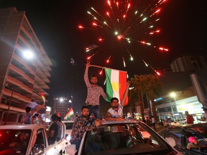 Iraqi Kurds wave the Kurdish flag as they celebrate in the streets of the northern city of Arbil on September 25, 2017 following a referendum on independence.Iraq's Kurds defied widespread opposition to vote in a historic independence referendum, sparking fresh tensions with Baghdad, threats from Turkey and fears of unrest. / AFP PHOTO / Safin HAMED (Photo credit should read SAFIN HAMED/AFP/Getty Images)