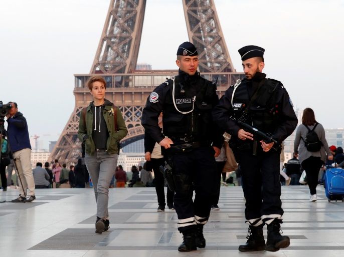 Police patrol at the Trocadero near the Eiffel Tower after a policeman was killed and two others were wounded in a shooting incident in Paris, France, April 21, 2017. REUTERS/Charles Platiau