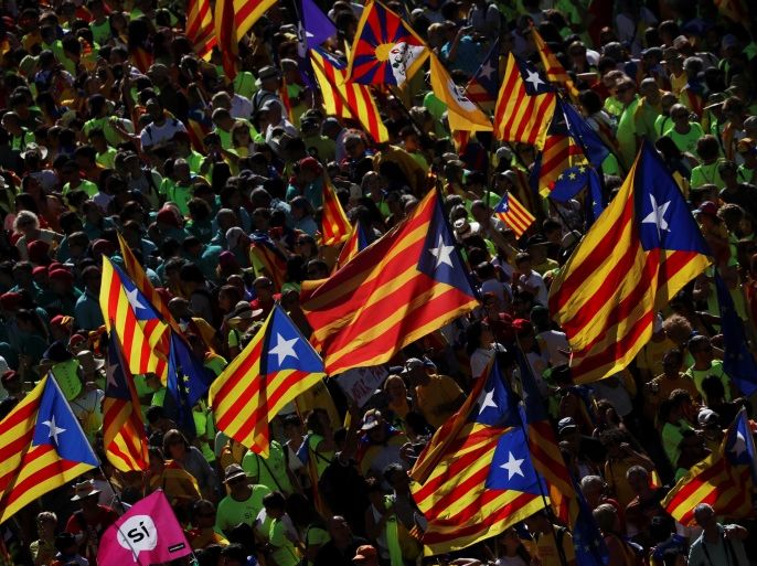Esteladas (Catalan separatist flags) wave in the air as thousands of people gather for a rally on Catalonia's national day 'La Diada' in Barcelona, Spain, September 11, 2017. REUTERS/Susana Vera
