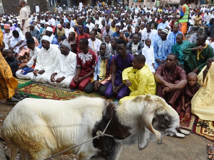 Muslims gather for the Friday noon prayers during Eid al-Adha celebrations in the Adjame district of Abidjan on September 1, 2017.Muslims across the world are preparing to celebrate the annual holiday of Eid al-Adha, or the Festival of Sacrifice, by visiting the tombs of their loved ones and slaughtering sheep, goats, cows and camels, marking the end of the Hajj pilgrimage to Mecca and in commemoration of Prophet Abraham's readiness to sacrifice his son, Ismail, on God