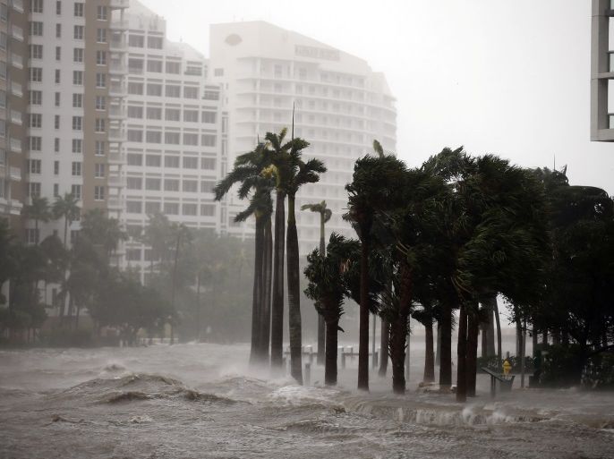Water rises up to a sidewalk by the Miami river as Hurricane Irma arrives at south Florida, in downtown Miami, Florida, U.S., September 10, 2017. REUTERS/Carlos Barria