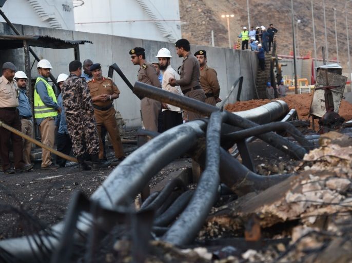 A group of Saudi officials, foreign and local workers and journalists inspect the damage at a power station on August 27, 2016 in the Saudi border city of Najran, a day after it was struck by a rocket fired from Yemen. The attack on the transformer in Najran, which lies just across the Yemen border, marks a rare hit on Saudi Arabia's infrastructure after months of periodic bombardment of the area. Cross-border attacks into Saudi Arabia have intensified since the suspen