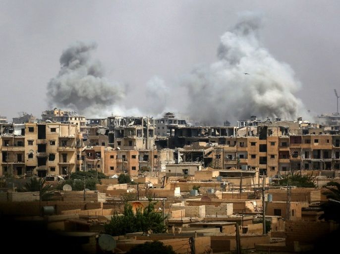 A picture taken on September 5, 2017 shows smoke billowing out following a coalition air strike in the western al-Daraiya neighbourhood of the embattled northern Syrian city of Raqa. / AFP PHOTO / Delil souleiman (Photo credit should read DELIL SOULEIMAN/AFP/Getty Images)