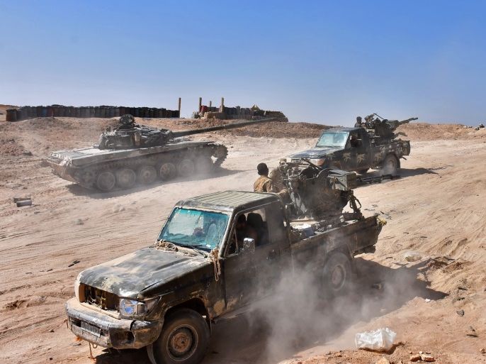 Syrian forces begin their advance on the area of Bughayliyah, on the northern outskirts of Deir Ezzor on September 13, 2017, during their ongoing battle against the Islamic State (IS) group. After breaking an Islamic State group blockade, Syria's army is seeking to encircle the remaining jihadist-held parts of Deir Ezzor city, a military source. / AFP PHOTO / George OURFALIAN (Photo credit should read GEORGE OURFALIAN/AFP/Getty Images)