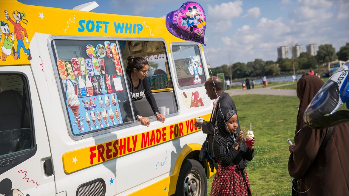 LONDON, ENGLAND - SEPTEMBER 01: A family purchase ice creams in Burgess Park during the first day of Eid al-Adha celebrations on September 1, 2017 in London, England. Muslims across the world are beginning two days of celebrations for Eid al-Adha, one of the two holiest Muslim holidays, that honours the willingness of prophet Abraham to sacrifice his son Ismail, in an act of obedience to God'. (Photo by Rob Stothard/Getty Images)