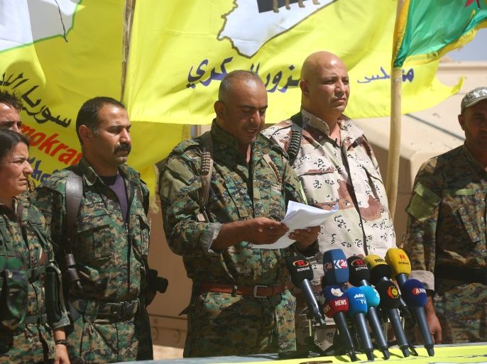 Ahmad Abu Khawlah (3rd-R), chief of the Deir Ezzor Military Council (DEMC) -- a coalition of Arab tribes and fighters that belongs to the broader US-backed Syrian Democratic Forces -- speaks during a press conference in the northeastern Syrian village of Abu Fas, on the southern outskirts of Hasakah province, on September 9, 2017.Abu Khawlah announced the launch of a new offensive to oust the Islamic State (IS) group from swathes of Syria's eastern Deir Ezzor province on September 9, 2017, aiming to clear the jihadists from territory east of the Euphrates River, in addition to the fighting already taking place to retake their de-facto capital in Raqa.Syrian regime forces are also fighting a separate offensive to oust IS from the Deir Ezzor provincial capital. / AFP PHOTO / DELIL SOULEIMAN (Photo credit should read DELIL SOULEIMAN/AFP/Getty Images)