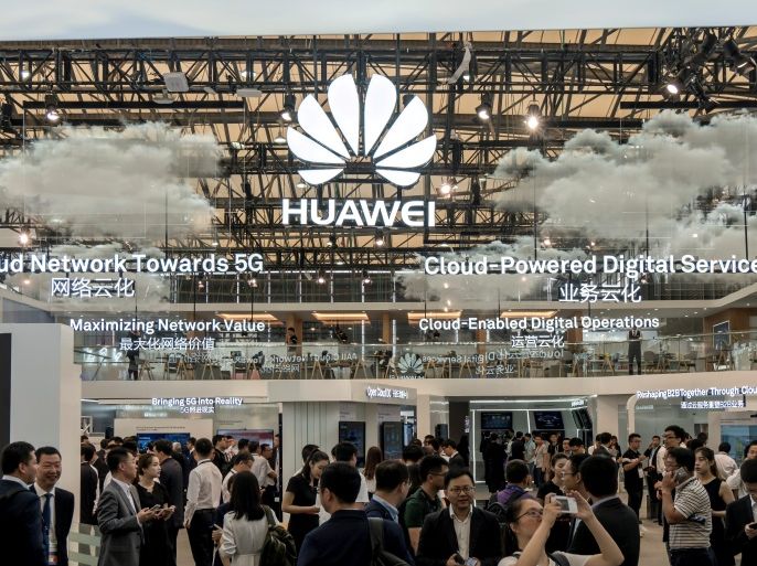 FILE PHOTO: Visitors are seen at HUAWEI stand during the 2017 Mobile World Congress in Shanghai, China June 28, 2017. REUTERS/Stringer ATTENTION EDITORS - THIS IMAGE WAS PROVIDED BY A THIRD PARTY. CHINA OUT