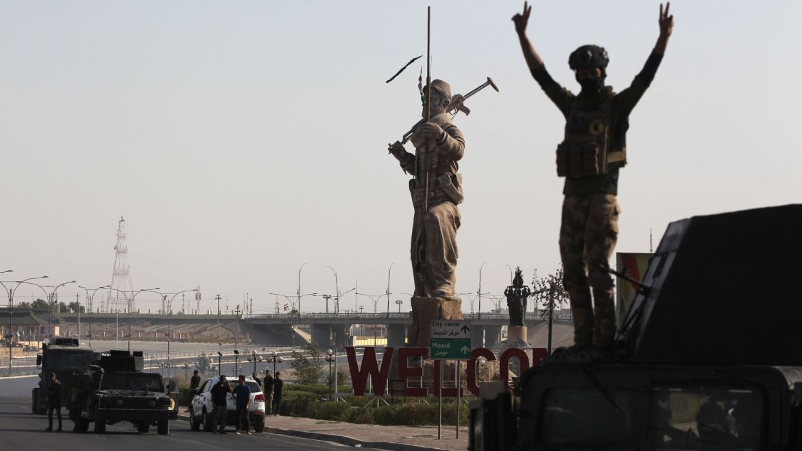 An Iraqi forces member gestures as they advance in the centre of Kirkuk during an operation against Kurdish fighters on October 16, 2017. Iraqi forces seized the Kirkuk governor's office, key military sites and an oil field as they swept across the disputed province following soaring tensions over an independence referendum. / AFP PHOTO / AHMAD AL-RUBAYE        (Photo credit should read AHMAD AL-RUBAYE/AFP/Getty Images)