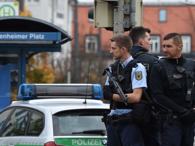 German police officers stand guard near Rosenheimer square after a man attacked passersby on October 21, 2017 in the southern German city of Munich.The man attacked passersby in five places near Rosenheimer Platz in the eastern part of the city centre at around 0630 GMT, inflicting light injuries on four people, a police spokesman told AFP. The perpetrator, described by the police as a man in his forties, wearing grey pants and a running jacket, fled the scene on a black bicycle. / AFP PHOTO / Christof STACHE (Photo credit should read CHRISTOF STACHE/AFP/Getty Images)