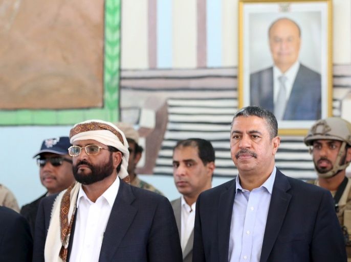 Yemen's Vice President and Prime Minister Khaled Bahah (2nd R) stand for the national anthem during a meeting with local officials after his arrival to the country's northern province of Marib November 22, 2015. REUTERS/Ali Owidha