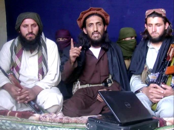 In this file image taken from a video recording, Omar Khalid Khorasani (C), a top Pakistan Taliban commander, gives an interview in Pakistan's Mohmand tribal region on June 2, 2011. General Asim Bajwa, director general of the Pakistani army's media division, reported the death of Umar Narai, also known as Khalifa Umar Mansoor or Khalid Khurasani, in a message on Twitter on July 13, 2016. REUTERS/Handout/File Photo TPX IMAGES OF THE DAY