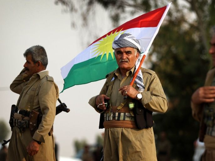An Iranian Kurdish Peshmerga member of the Kurdistan Democratic Party of Iran (KDP-Iran), holds a Kurdish flag as he takes part in a gathering to urge people to vote in the upcoming independence referendum in the town of Bahirka, north of Arbil, the capital of the autonomous Kurdish region of northern Iraq, on September 21, 2017.The controversial referendum on independence for Iraqi Kurdistan is set for September 25. / AFP PHOTO / SAFIN HAMED (Photo credit should read SAFIN HAMED/AFP/Getty Images)
