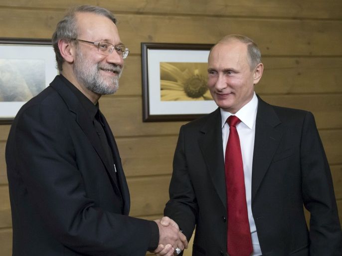 Russia's President Vladimir Putin (R) shakes hands with Iran's parliament speaker Ali Larijani as they meet after a session of the Valdai International Discussion Club in Sochi, Russia, October 22, 2015. REUTERS/Alexander Zemlianichenko/Pool TPX IMAGES OF THE DAY