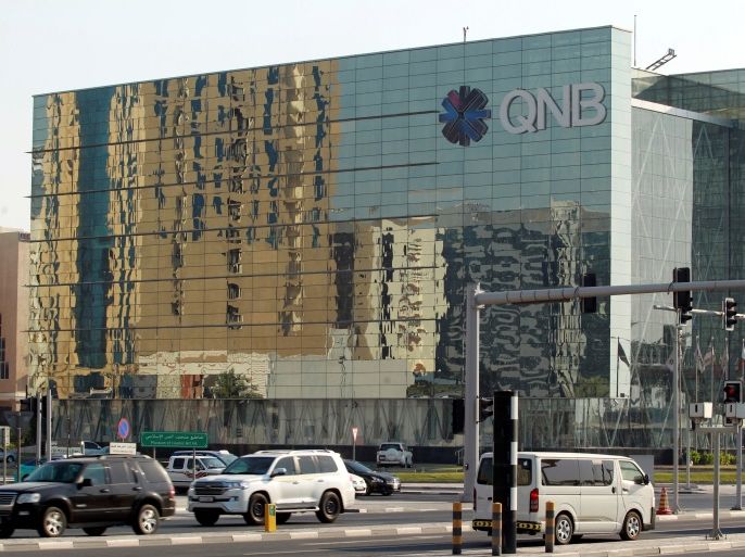 Cars drive past the building of Qatar National Bank (QNB) in Doha, Qatar, June 11, 2017. REUTERS/Naseem Zeitoon
