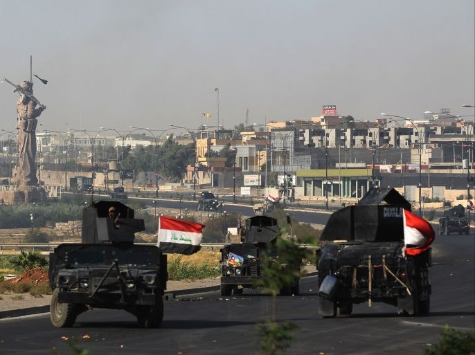 Iraqi forces advance towards the centre of Kirkuk during an operation against Kurdish fighters on October 16, 2017. Iraqi forces seized the Kirkuk governor's office, key military sites and an oil field as they swept across the disputed province following soaring tensions over an independence referendum. / AFP PHOTO / AHMAD AL-RUBAYE (Photo credit should read AHMAD AL-RUBAYE/AFP/Getty Images)