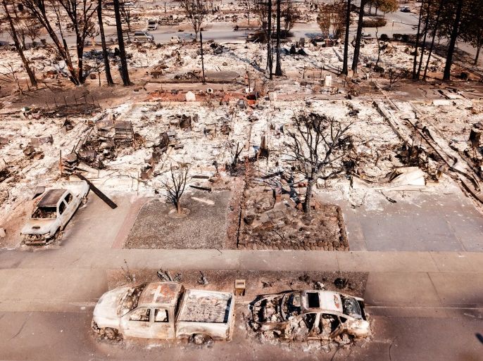 TOPSHOT - Fire damage is seen from the air in the Coffey Park neighborhood October 11, 2017, in Santa Rosa, California.More than 200 fire engines and firefighting crews from around the country were being rushed to California on Wednesday to help battle infernos which have left at least 21 people dead and thousands homeless. / AFP PHOTO / Elijah Nouvelage (Photo credit should read ELIJAH NOUVELAGE/AFP/Getty Images)