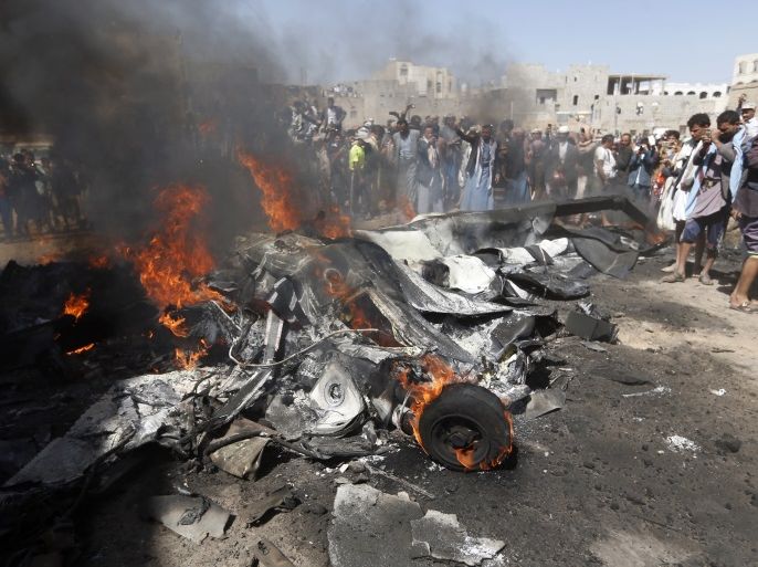 Yemenis gather around burning wreckage of a drone in the country's capital Sanaa, on October 1, 2017.A drone crashed at the northern exit of the Yemeni capital without causing casualties and the Houthis rebels claimed that it had been shot down by their anti-aircraft defense. / AFP PHOTO / MOHAMMED HUWAIS (Photo credit should read MOHAMMED HUWAIS/AFP/Getty Images)