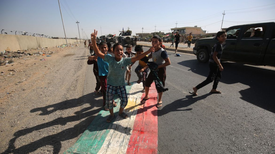 Iraqi children step on a Kurdish flag as forces advance towards the centre of Kirkuk during an operation against Kurdish fighters on October 16, 2017. Iraqi forces seized the Kirkuk governor's office, key military sites and an oil field as they swept across the disputed province following soaring tensions over an independence referendum. / AFP PHOTO / AHMAD AL-RUBAYE        (Photo credit should read AHMAD AL-RUBAYE/AFP/Getty Images)