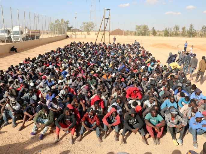 Migrants sit at a detention center in Gharyan, Libya October 12, 2017. REUTERS/Hani Amara TPX IMAGES OF THE DAY