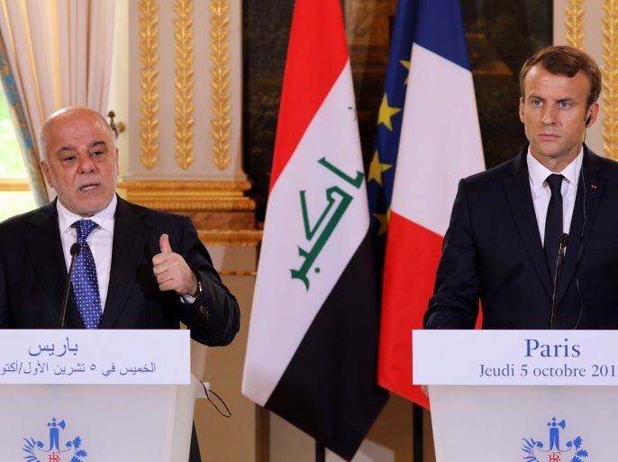 French President Emmanuel Macron and Iraqi Prime minister Haider Al-Abadi attend a joint news conference at the Elysee Palace in Paris, France, October 5, 2017. REUTERS/Ludovic Marin/Pool