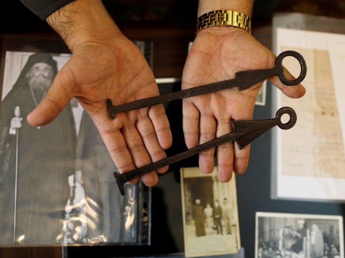 Adeeb Joudeh, a Muslim, displays the ancient keys to the Church of the Holy Sepulchre, during an interview with Reuters at his home near Jerusalem's Old City November 8, 2017. Picture taken November 8, 2017. REUTERS/Ronen Zvulun