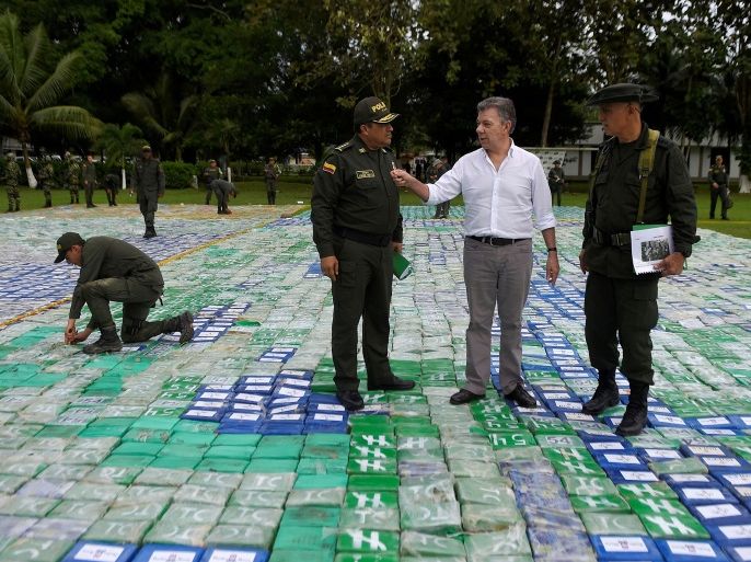Colombia's President Juan Manuel Santos looks on after the seizure of more than 12 tons of cocaine in Apartado, Colombia November 8, 2017. Colombian Presidency/Handout via REUTERS ATTENTION EDITORS - THIS IMAGE HAS BEEN SUPPLIED BY A THIRD PARTY