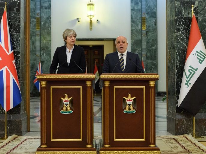 BAGHDAD, IRAQ - NOVEMBER 29: British Prime Minister Theresa May (L) and Iraqi Prime Minister Haider Al-Abadi make statements to the media following a bi-lateral meeting in the Government Palace on November 29, 2017 in Baghdad, Iraq. Theresa May has made a surprise visit to Iraq during a planned visit to the Middle East. (Photo by Leon Neal-Pool/Getty Images)