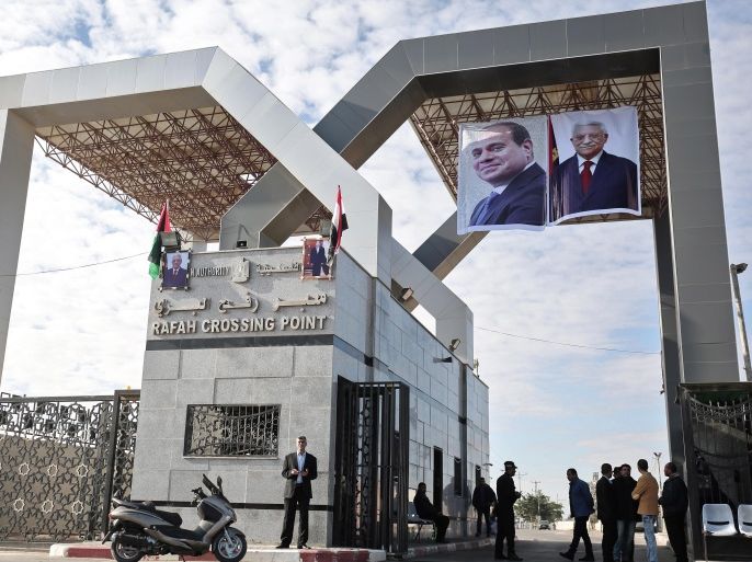 Portraits of Egyptian President Abdel Fattah al-Sisi and Palestinian leader Mahmud Abbas hang at the Rafah border crossing with Egypt on November 1, 2017. Hamas handed over control of the Gaza Strip's border with Egypt to the Palestinian Authority today, a first key test of a Palestinian reconciliation agreement agreed last month, an AFP journalist said. / AFP PHOTO / SAID KHATIB (Photo credit should read SAID KHATIB/AFP/Getty Images)