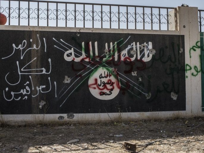 BA'AJ, IRAQ - JUNE 20: An Islamic State sign in the north-western Iraq town of Ba'aj, June 20, 2017, near the Iraq-Syria border. The Popular Mobilisation Front (PMF) forces, composed of majority Shi’ite militia, part of the Iraqi forces, have pushed Islamic State militants from the north-western Iraq border strip back into Syria. The PMF now hold the border, crucial to the fall of Islamic State in Mosul, blocking the Islamic State supply route for militants from Syria to Mosul. (Martyn Aim/Getty Images)