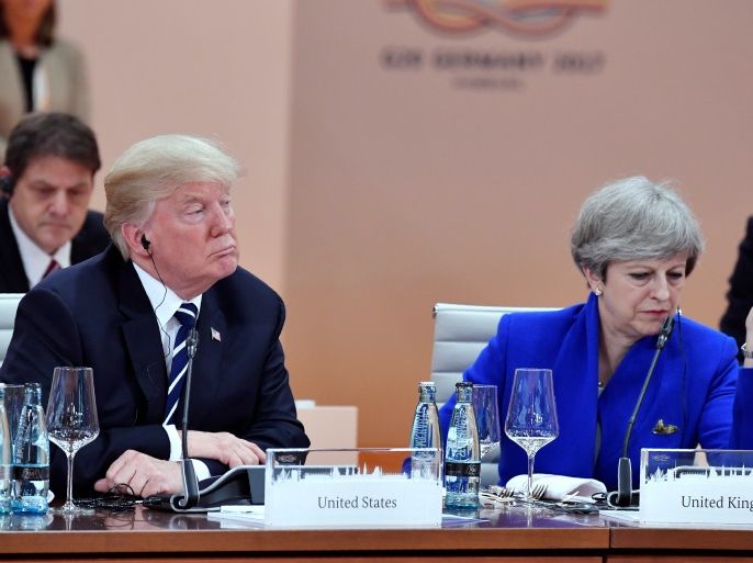US President Donald Trump and Britain's Prime Minister Theresa May sit at the start of the first working session of the G20 meeting in Hamburg, Germany, July 7, 2017. REUTERS/John MACDOUGALL,POOL