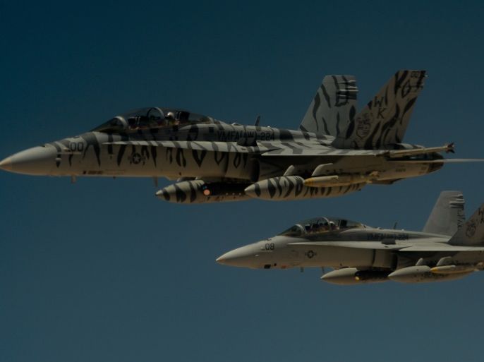 FILE PHOTO: Two U.S. Marine Corps F-18 Super Hornets depart after receiving fuel from a 908th Expeditionary Air Refueling Squadron KC-10 Extender during a flight in support of Operation Inherent Resolve May 31, 2017. U.S. Air Force/Staff Sgt. Michael Battles/Handout/File Photo via REUTERS ATTENTION EDITORS - THIS IMAGE WAS PROVIDED BY A THIRD PARTY