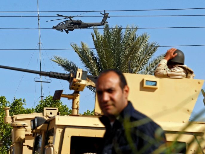 Military forces and helicopters secure an area in North Sinai, Egypt, December 1, 2017. Picture taken December 1, 2017. REUTERS/Mohamed Abd El Ghany