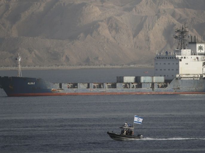An Israeli Navy boat escorts the Panamanian-flagged cargo vessel Klos C into the Israeli port of Eilat on Saturday after seizing it in the Red Sea on Wednesday, March 8, 2014. Israel said the Klos C was carrying dozens of advanced Iranian-supplied weapons made in Syria and intended for Palestinian guerrillas in the Gaza Strip. REUTERS/Finbarr O'Reilly (ISRAEL - Tags: POLITICS MILITARY TPX IMAGES OF THE DAY)