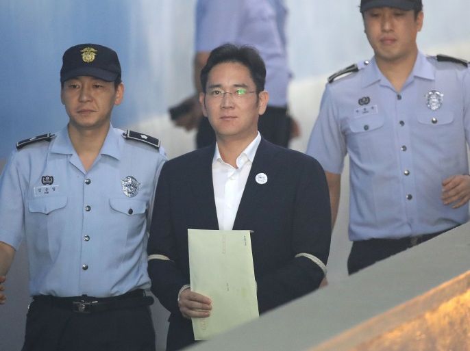 SEOUL, SOUTH KOREA - AUGUST 25: Lee Jae-yong, Samsung Group heir arrives at Seoul Central District Court to hear the bribery scandal verdict on August 25, 2017 in Seoul, South Korea. Prosecutors are seeking a 12-year jail sentence. Lee, de facto chief of South Korean conglomerate, faces five charges connecting the bribery scandal involving ousted former President Park Geun-hye and her confidant Choi Soon-sil. The verdict affects the business of Samsung, which has launc