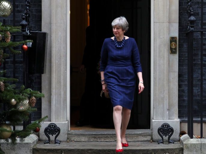 Britain's Prime Minister Theresa May walks out of 10 Downing Street to greet Spain's Prime Minister Mariano Rajoy, London, Britain December 5, 2017. REUTERS/Hannah McKay