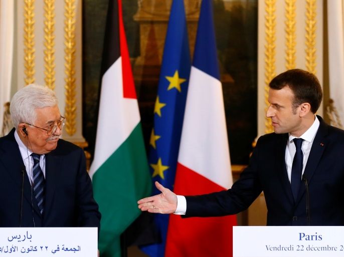 French President Emmanuel Macron (R) and Palestinian President Mahmoud Abbas deliver a press statement after a meeting at the Elysee Palace in Paris, France, December 22, 2017. REUTERS/Francois Mori/Pool