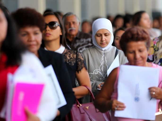 Recently naturalized U.S. citizens leave a swearing in ceremony in Los Angeles, U.S., July 18, 2017. Picture taken July 18, 2017. REUTERS/Mike Blake